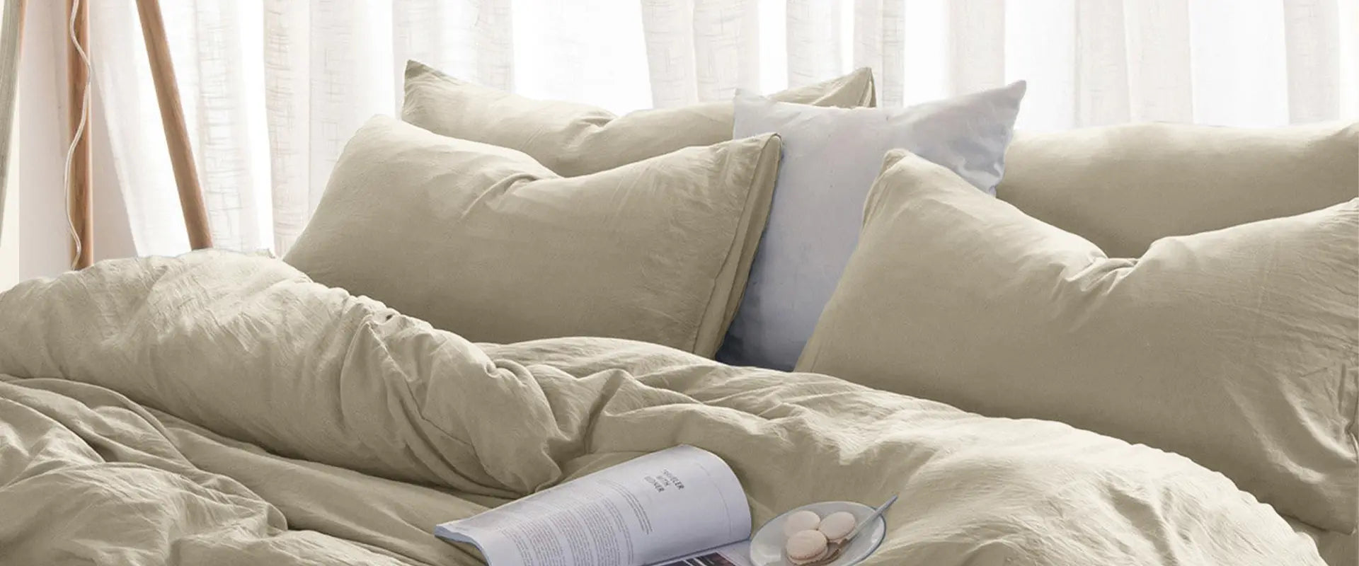 Beige bed linen set styled in a soft minimal modern bedroom with natural light.