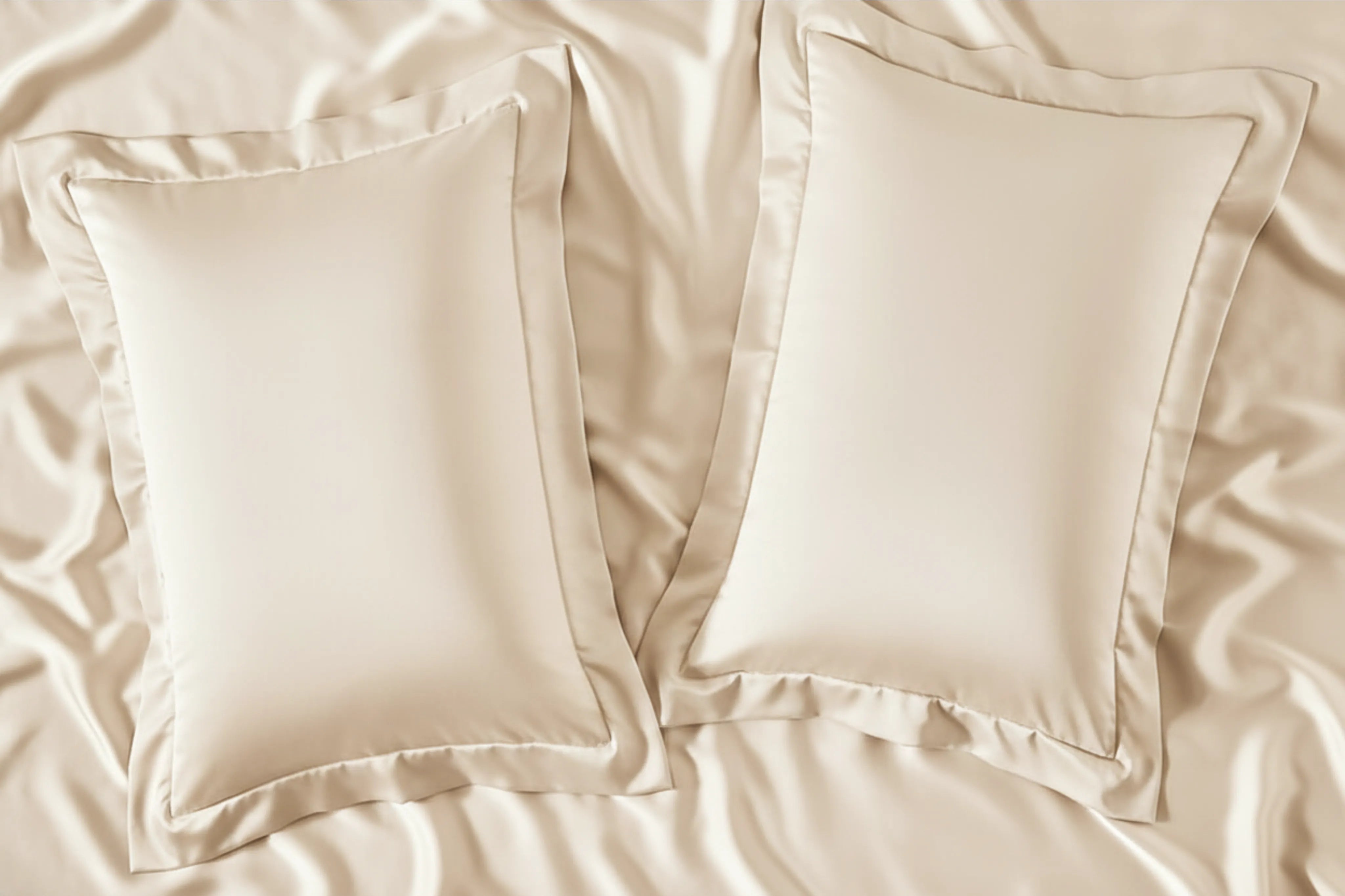Champagne satin pillow covers with smooth silky texture.