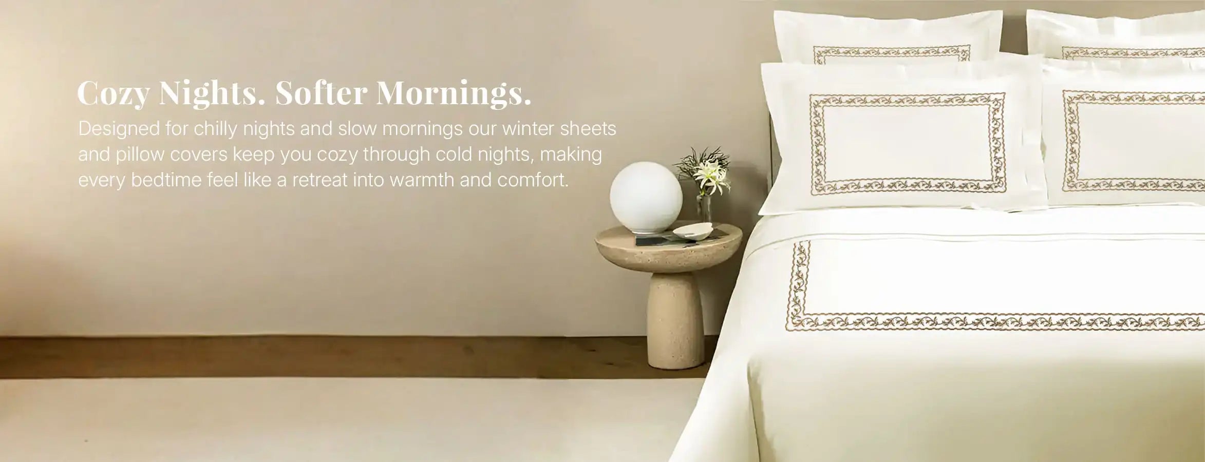 Cozy winter bed sheets with embroidered pillow covers styled on modern bed