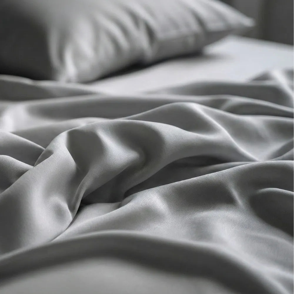 Close-up of grey eucalyptus sheet fabric showing soft and silky texture.
