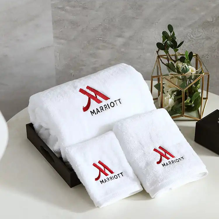 Luxury white cotton hotel bath, hand and face towel set with embroidery