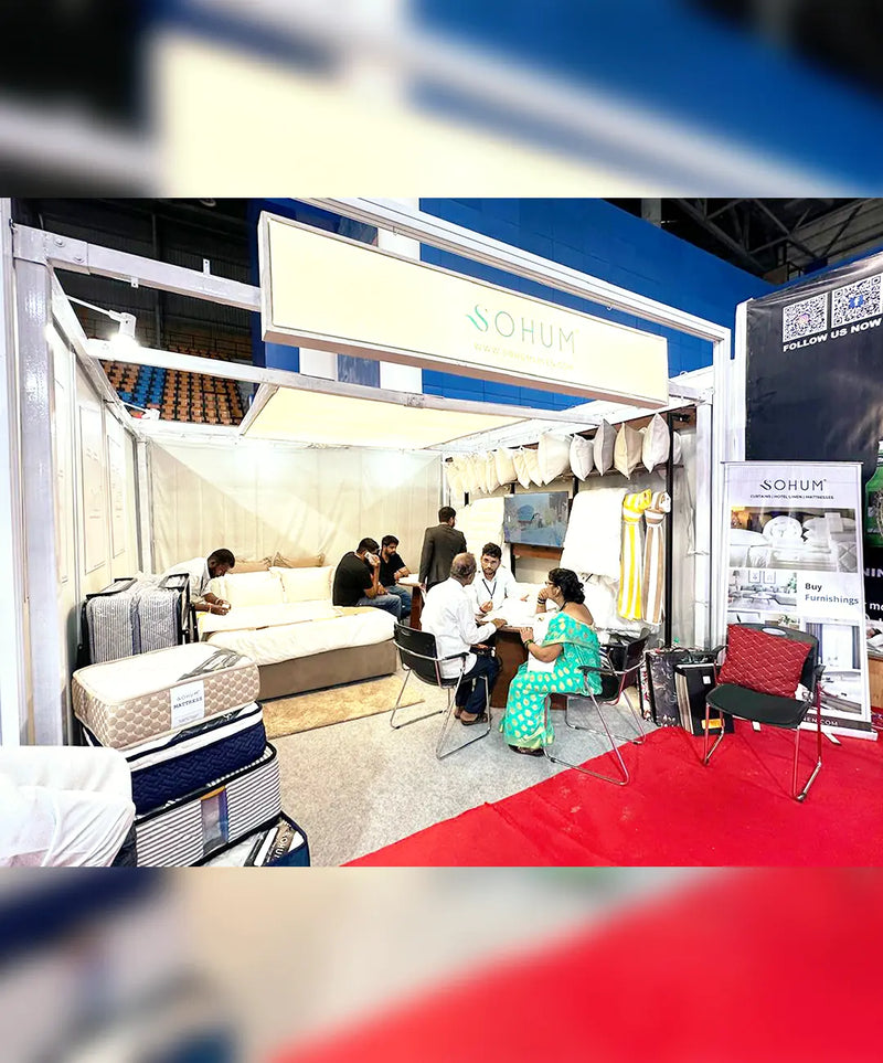 SOHUM bedding and mattress products displayed at a home textile trade exhibition booth