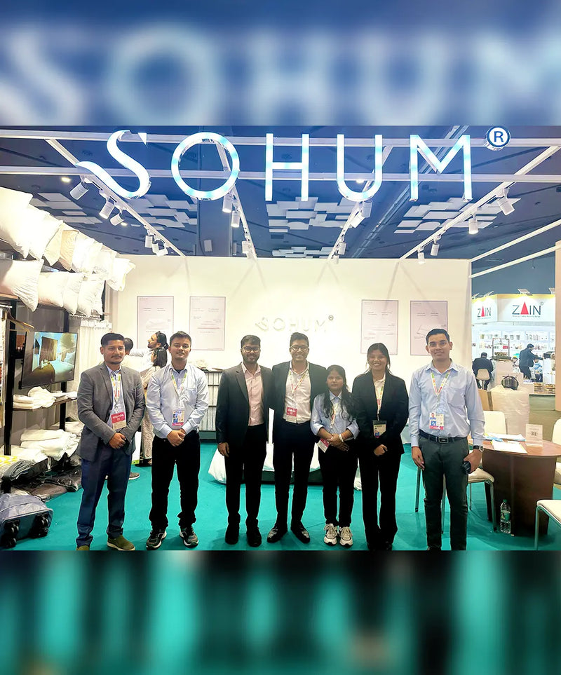 SOHUM team at hotel bedding and hospitality linen exhibition trade show booth