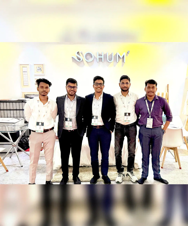 SOHUM team members at a home textile trade exhibition showcasing luxury hotel linen and bedding products