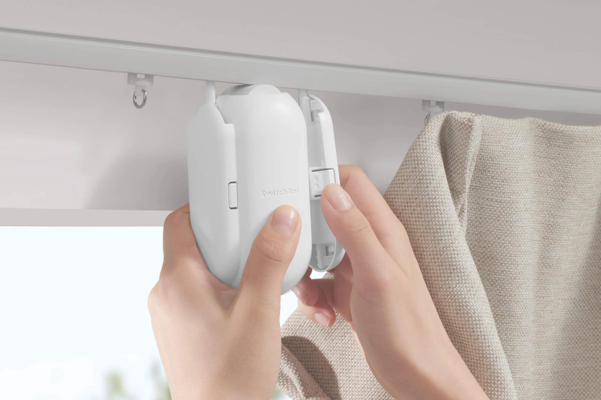 Smart curtain opener mounted on curtain track for automatic operation