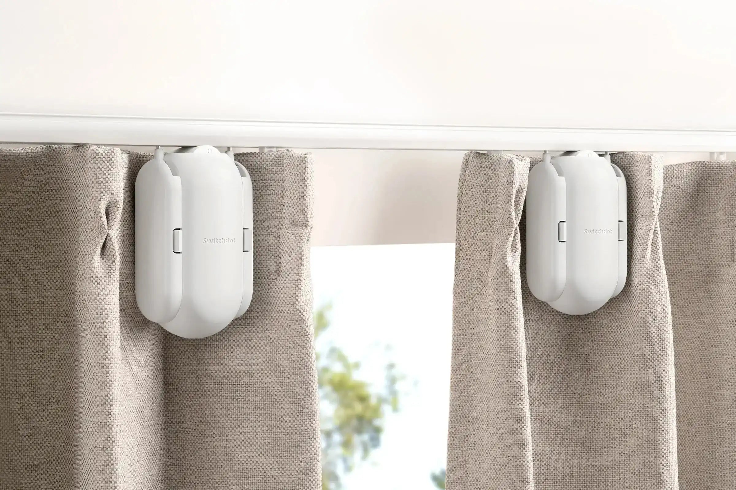 Dual SwitchBot motorized curtain system installed on curtain rail