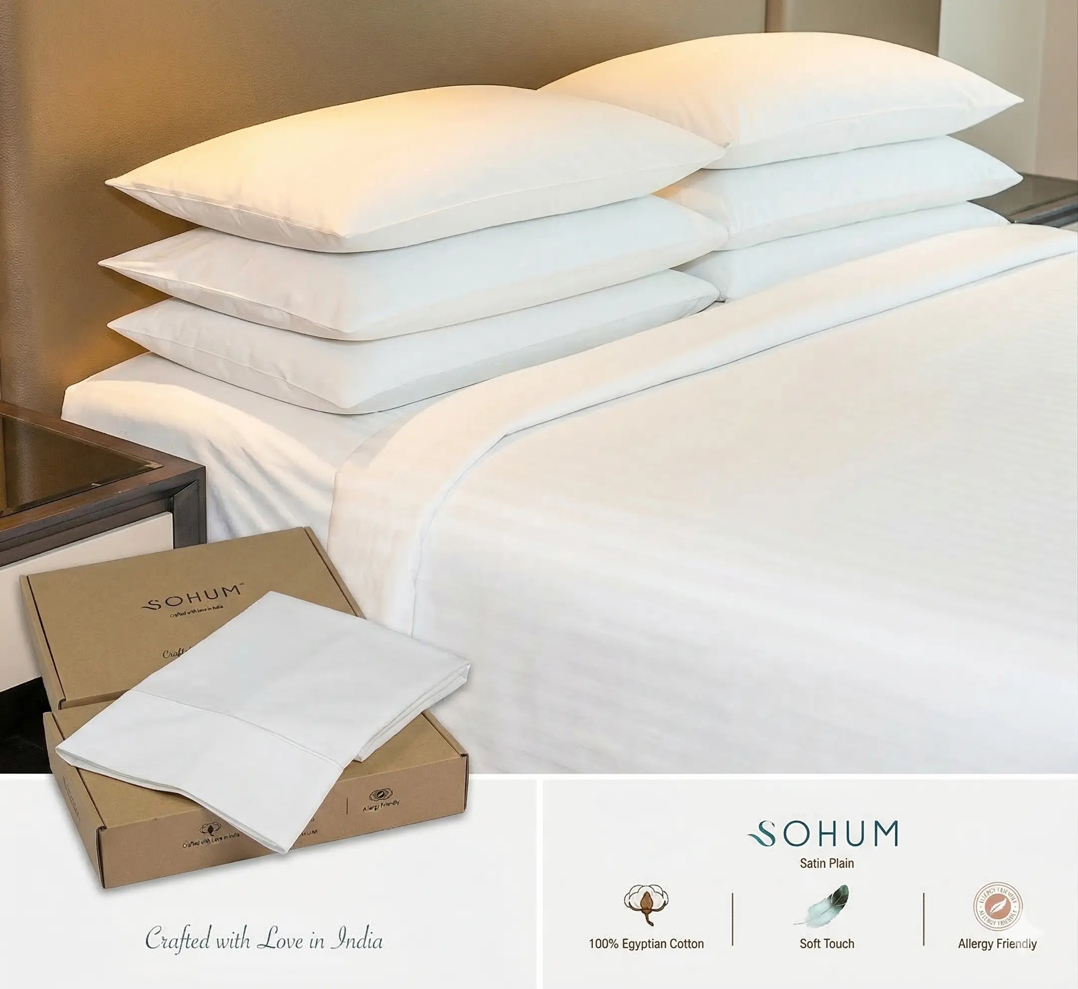 Stacked white bed pillows with clean hotel-style bedding set