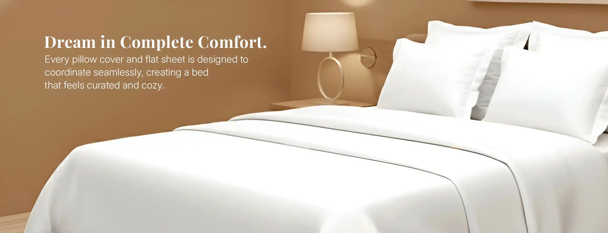 White pillow covers and flat sheet styled together on modern bedroom bed.